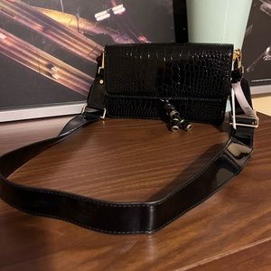 Black patent croc clutch with shoulder strap purse bag.